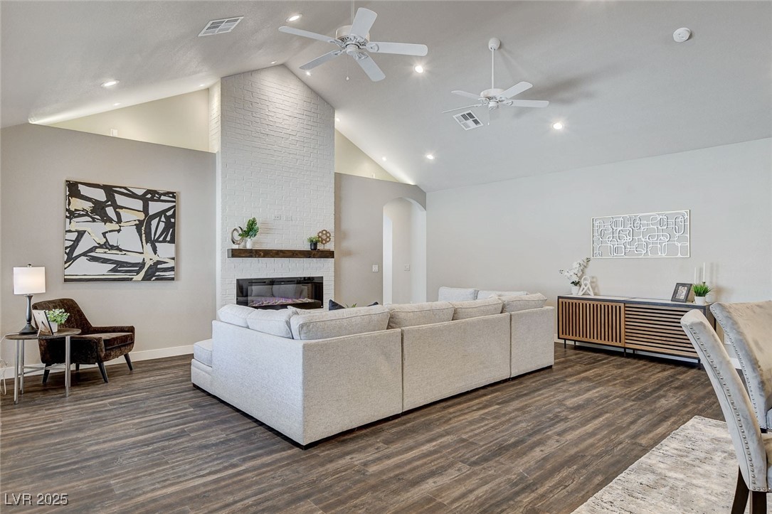 3196 Mateuse Street Logandale, NV 89021 - Photo 10 of 85 Living room featuring baseboards, arched walkways,