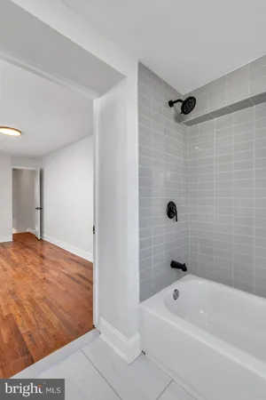 a bathroom with a sink a mirror and a shower curtain