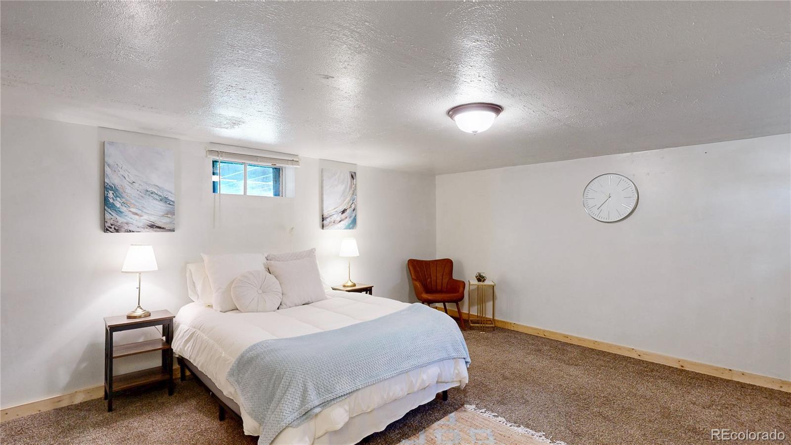 60 Ball Road Bailey, CO 80421 - Photo 12 of 37 a bedroom with a bed and a night stand