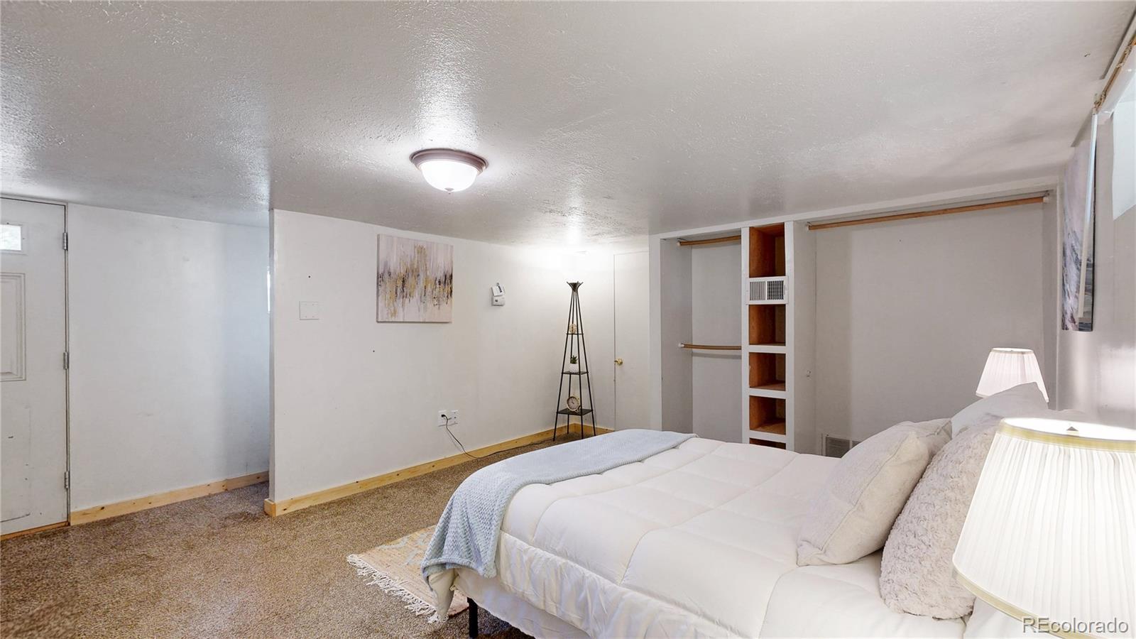 60 Ball Road Bailey, CO 80421 - Photo 13 of 37 a bedroom with a bed and a painting