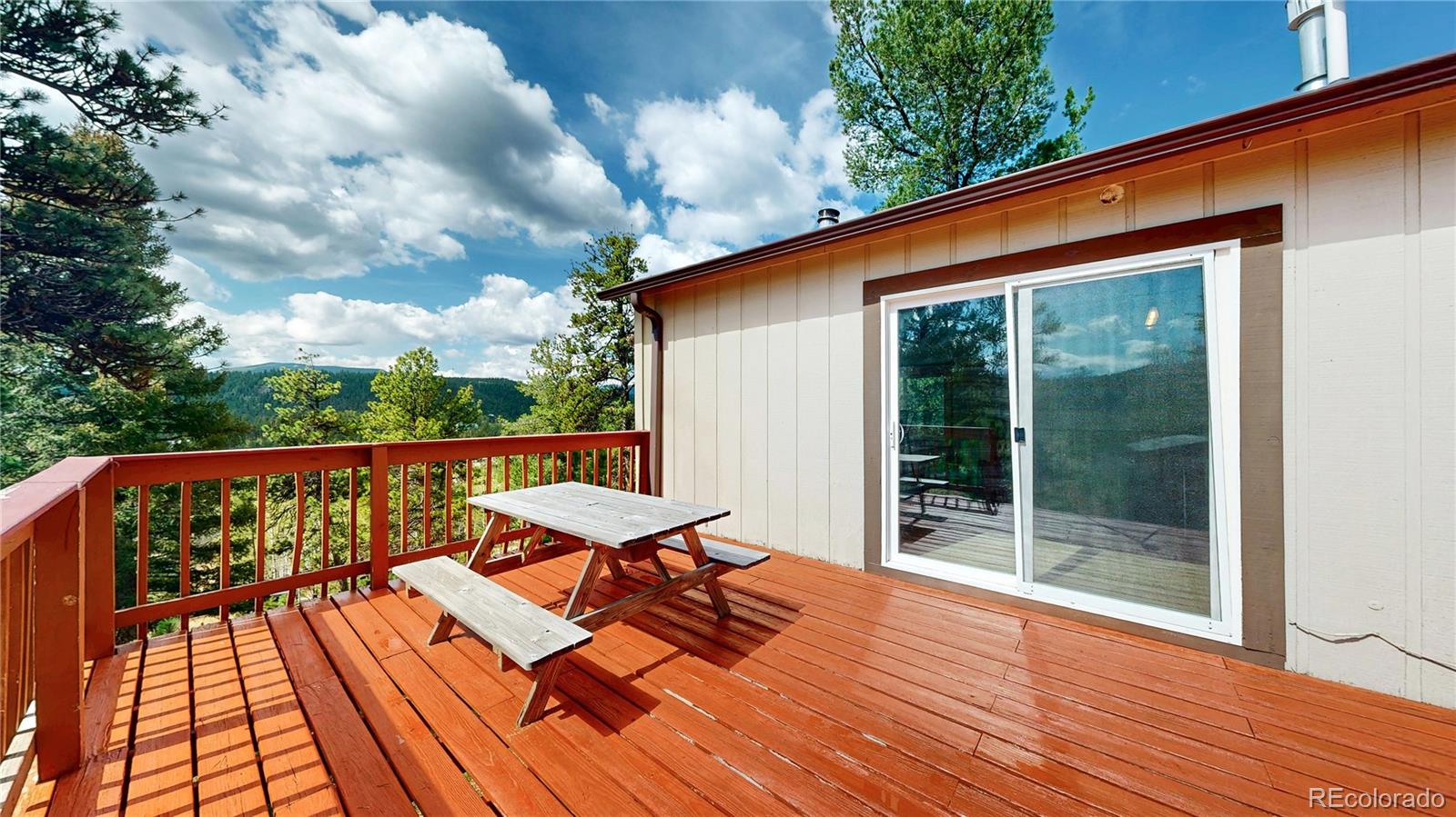 60 Ball Road Bailey, CO 80421 - Photo 17 of 37 a balcony view with a seating space