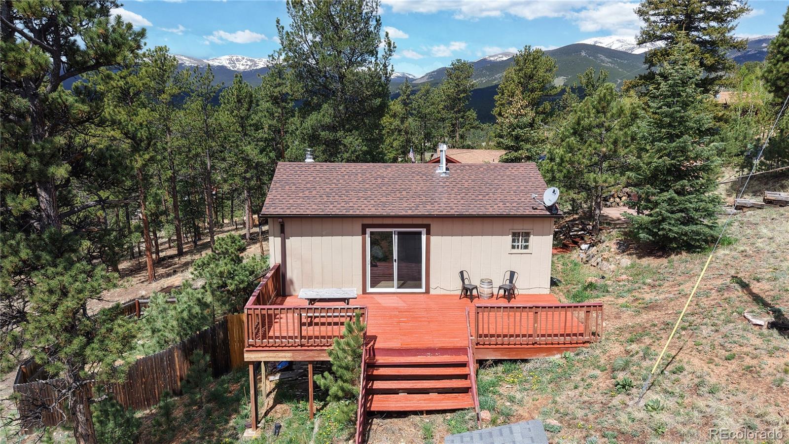 60 Ball Road Bailey, CO 80421 - Photo 31 of 37 a view of a house with a yard and sitting area