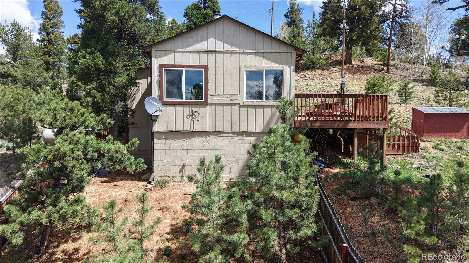 60 Ball Road Bailey, CO 80421 - Photo 32 of 37 a front view of a house with a yard and garage