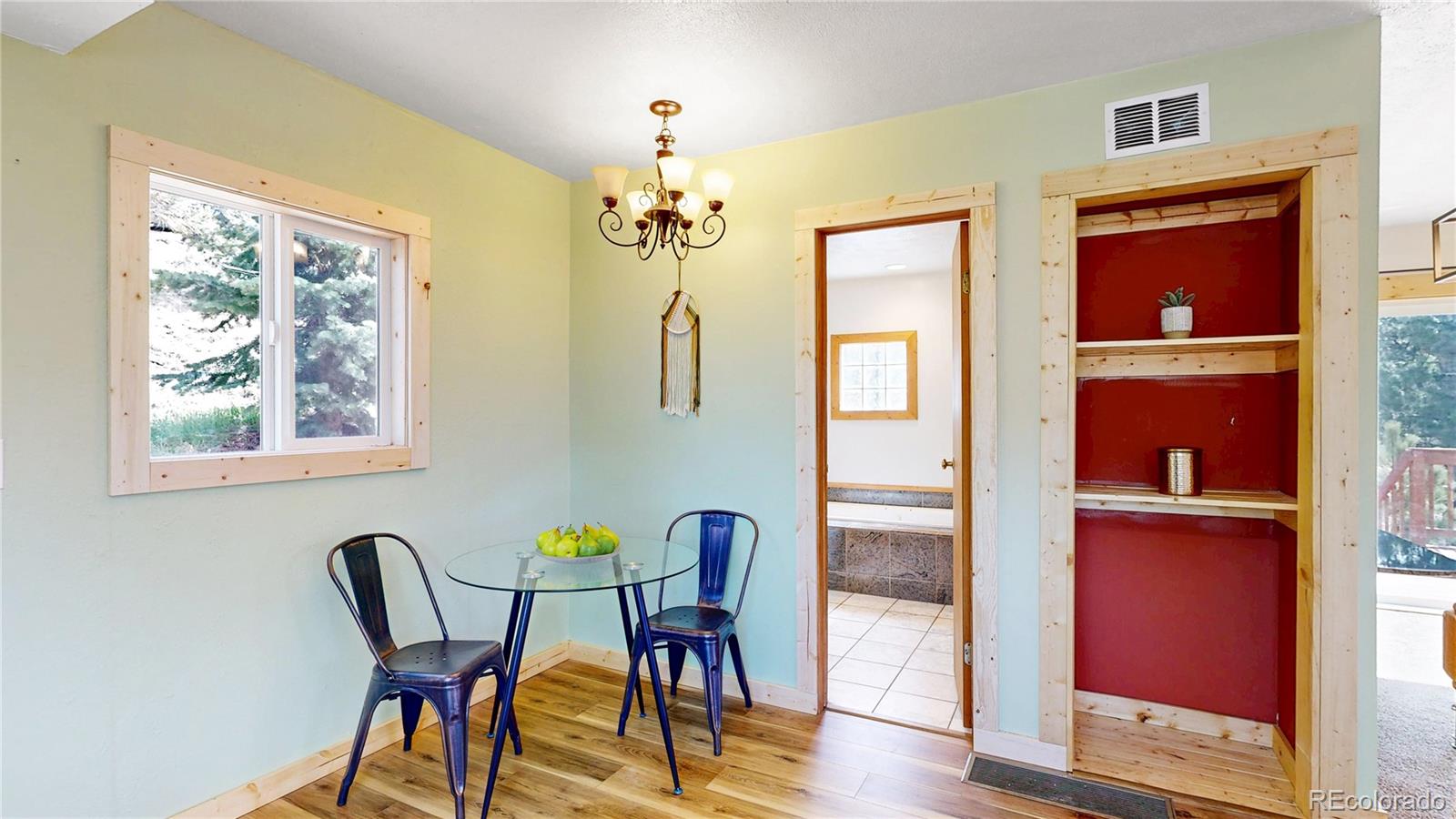 60 Ball Road Bailey, CO 80421 - Photo 7 of 37 a view of a dining room with furniture a chandelier and wooden floor