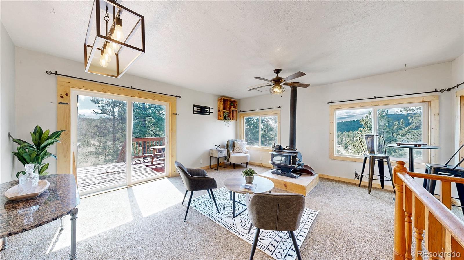 60 Ball Road Bailey, CO 80421 - Photo 9 of 37 a living room with furniture and a large window