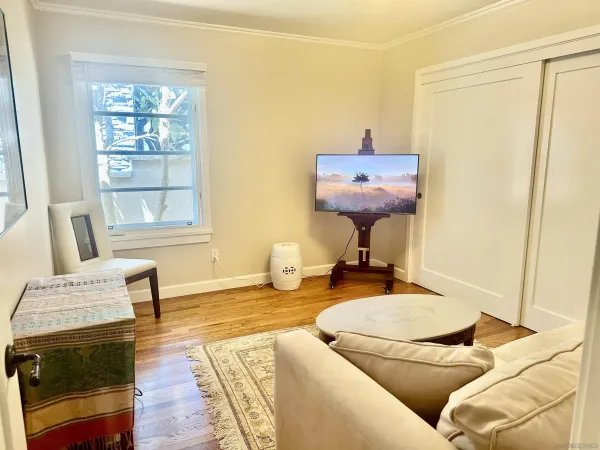 a living room with furniture and a window