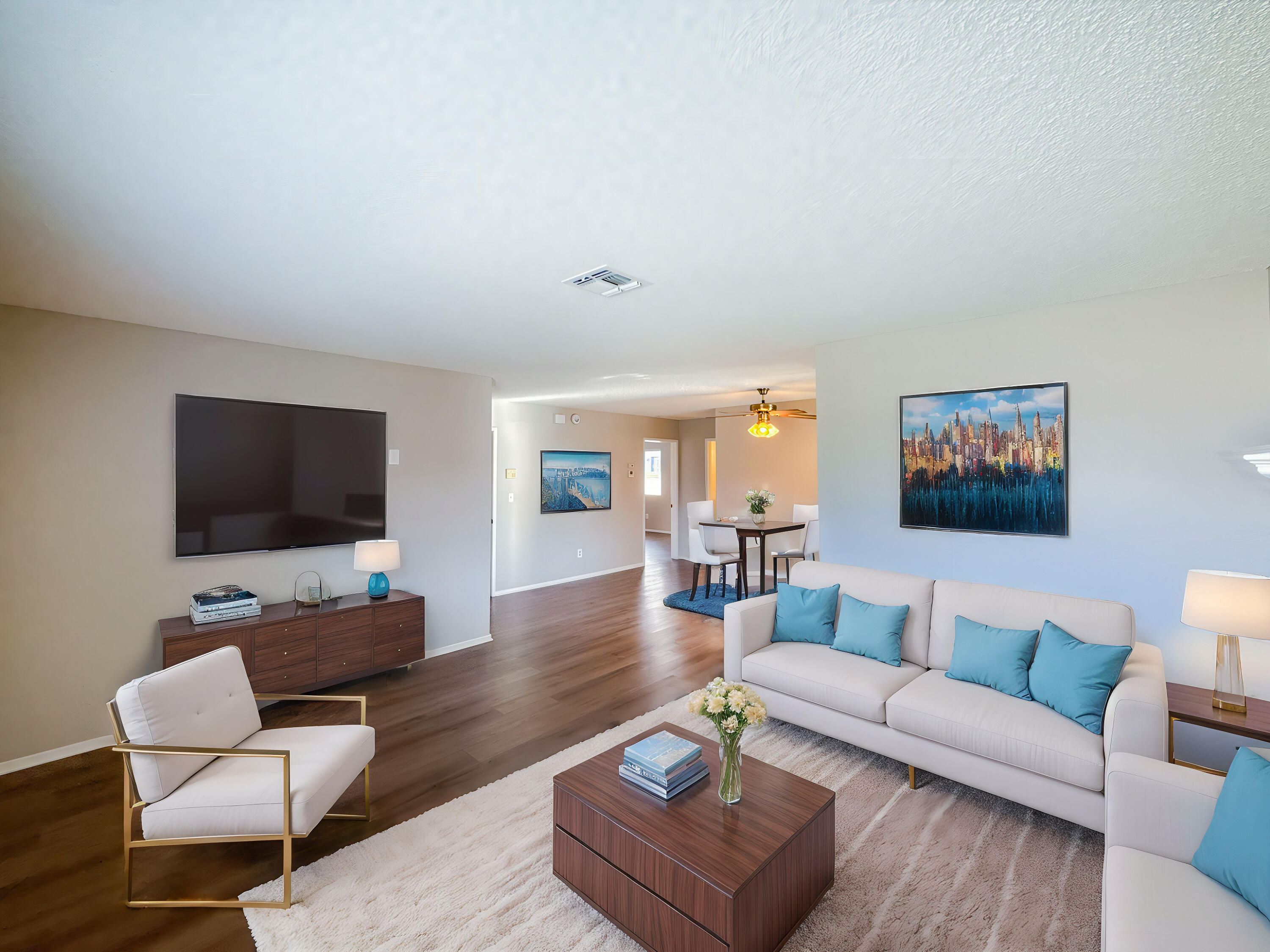 43840 Bobby Jones Drive, Unit 24 Lancaster, CA 93536 - Photo 13 of 29 a living room with furniture and a flat screen tv