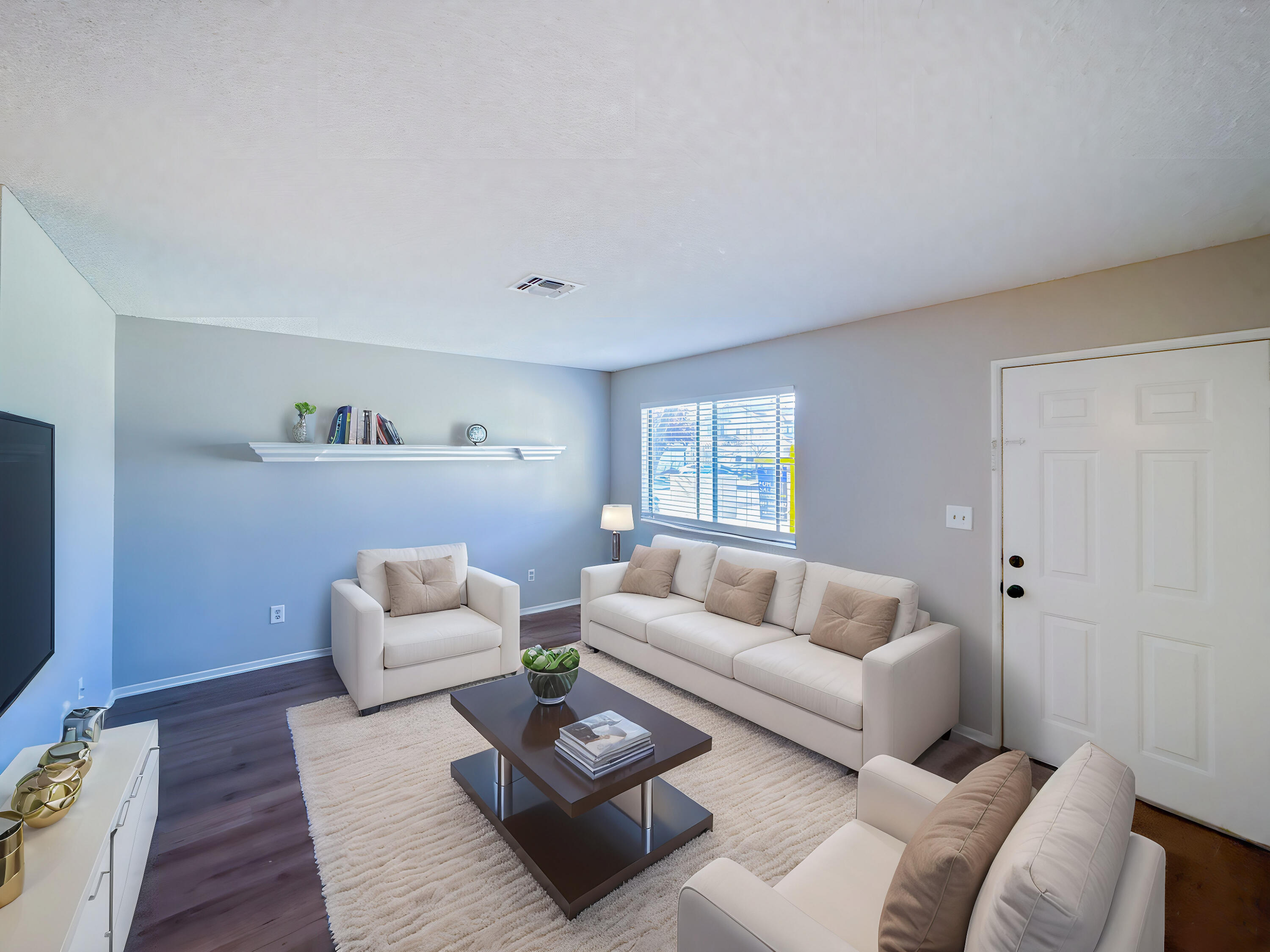 43840 Bobby Jones Drive, Unit 24 Lancaster, CA 93536 - Photo 14 of 29 a living room with furniture and a couch