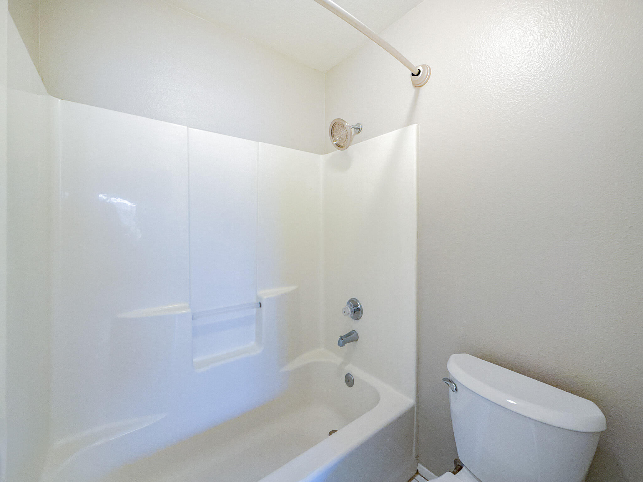43840 Bobby Jones Drive, Unit 24 Lancaster, CA 93536 - Photo 16 of 29 a bathroom with a toilet and a bathtub