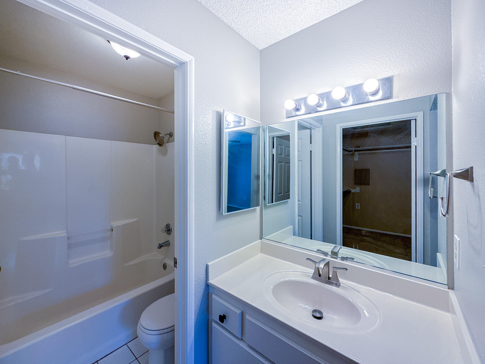 43840 Bobby Jones Drive, Unit 24 Lancaster, CA 93536 - Photo 19 of 29 a bathroom with a sink a toilet and shower