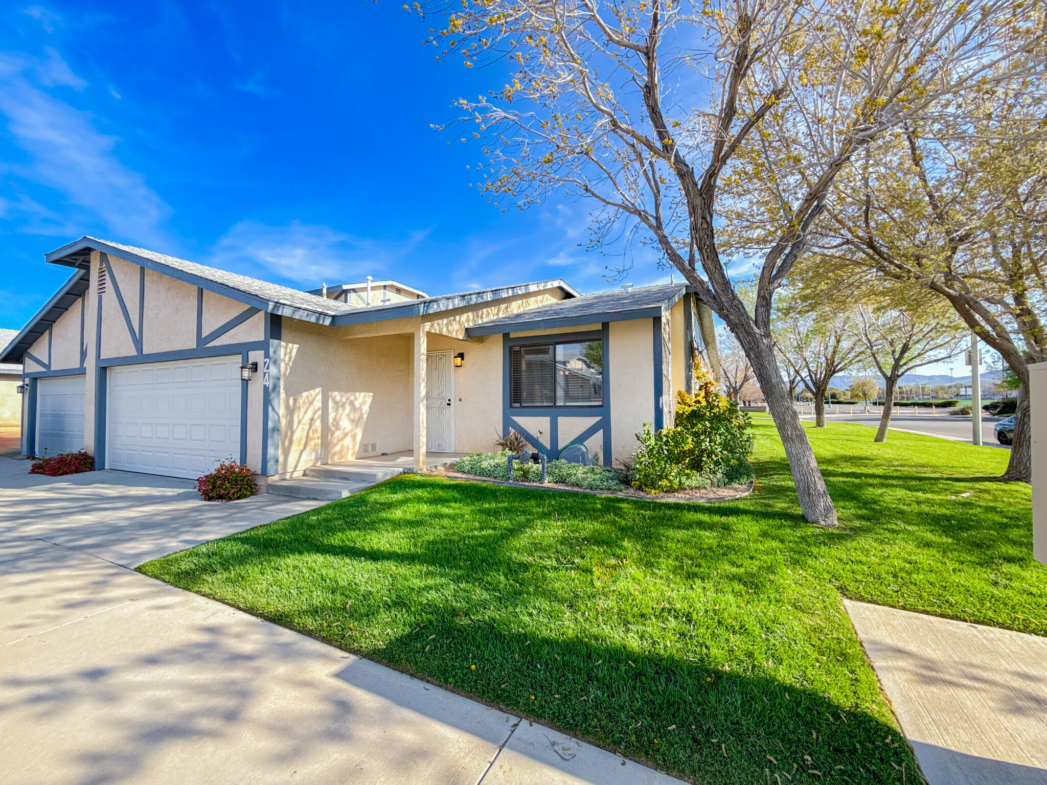 43840 Bobby Jones Drive, Unit 24 Lancaster, CA 93536 - Photo 2 of 29 a view of a house with a yard
