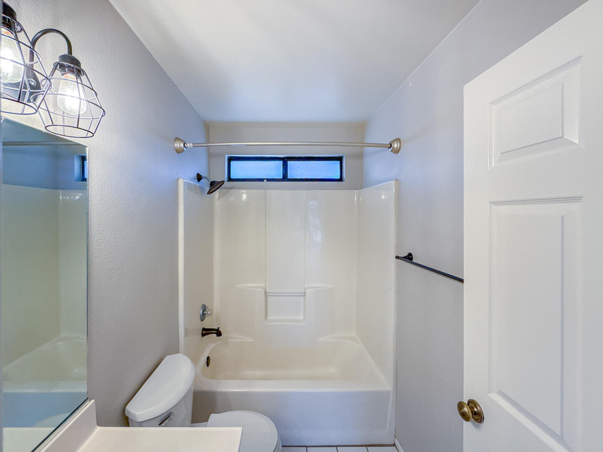 43840 Bobby Jones Drive, Unit 24 Lancaster, CA 93536 - Photo 24 of 29 a bathroom with a bathtub and a shower