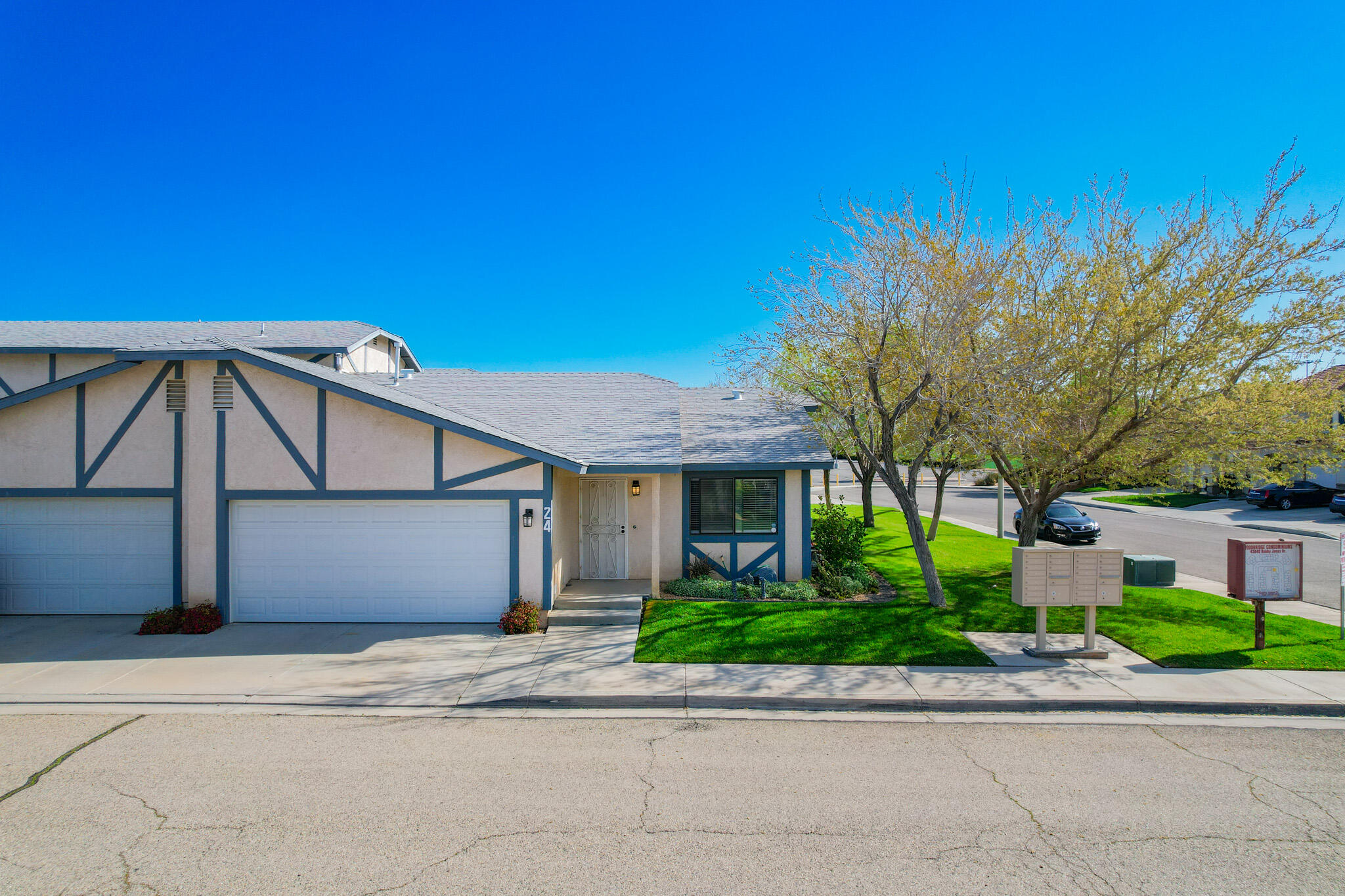 43840 Bobby Jones Drive, Unit 24 Lancaster, CA 93536 - Photo 4 of 29 a view of a house with a yard and plants