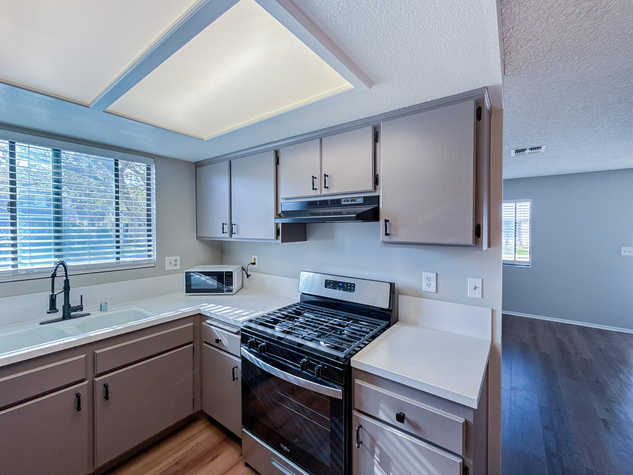 43840 Bobby Jones Drive, Unit 24 Lancaster, CA 93536 - Photo 9 of 29 a kitchen with stainless steel appliances granite countertop a sink stove and cabinets