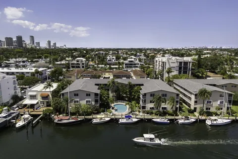 an aerial view of a houses with swimming pool and outdoor space
