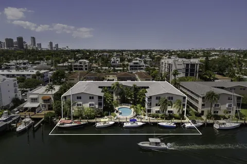 an aerial view of a houses with yard