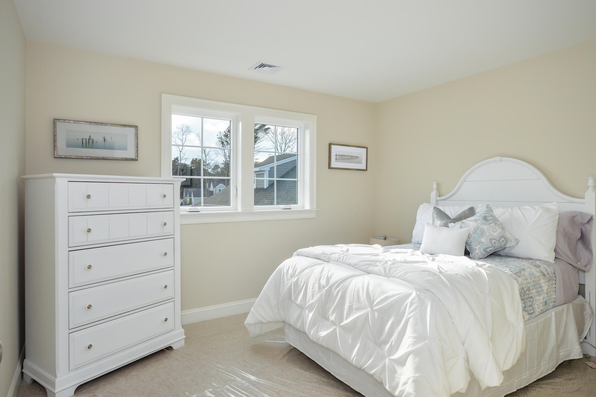56 Cobblestone Circle Mashpee, MA 02649 - Photo 12 of 33 a bedroom with a bed and a window