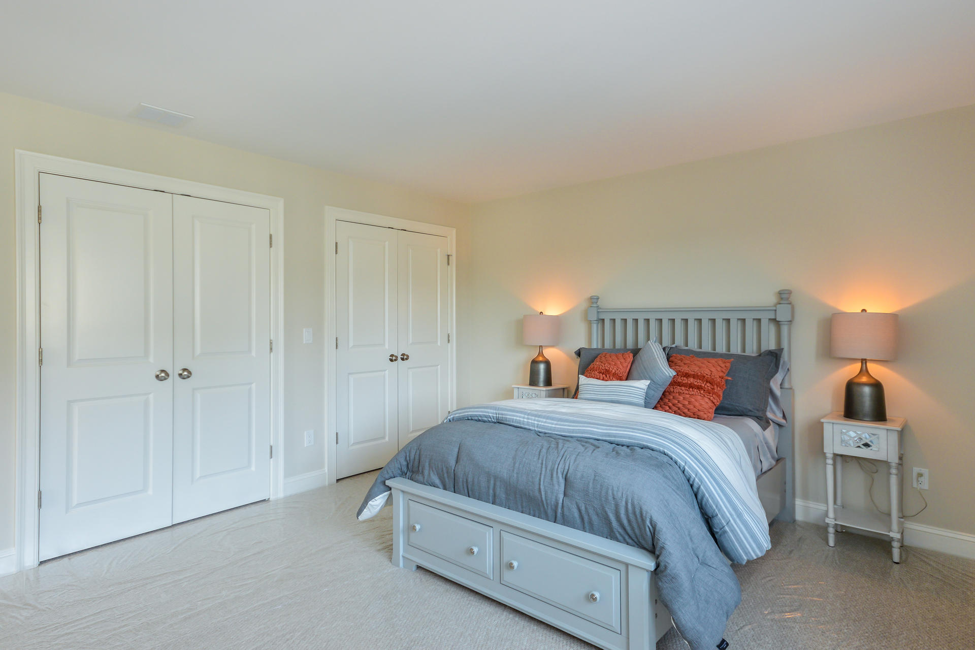 56 Cobblestone Circle Mashpee, MA 02649 - Photo 14 of 33 a bedroom with a bed and a lamp