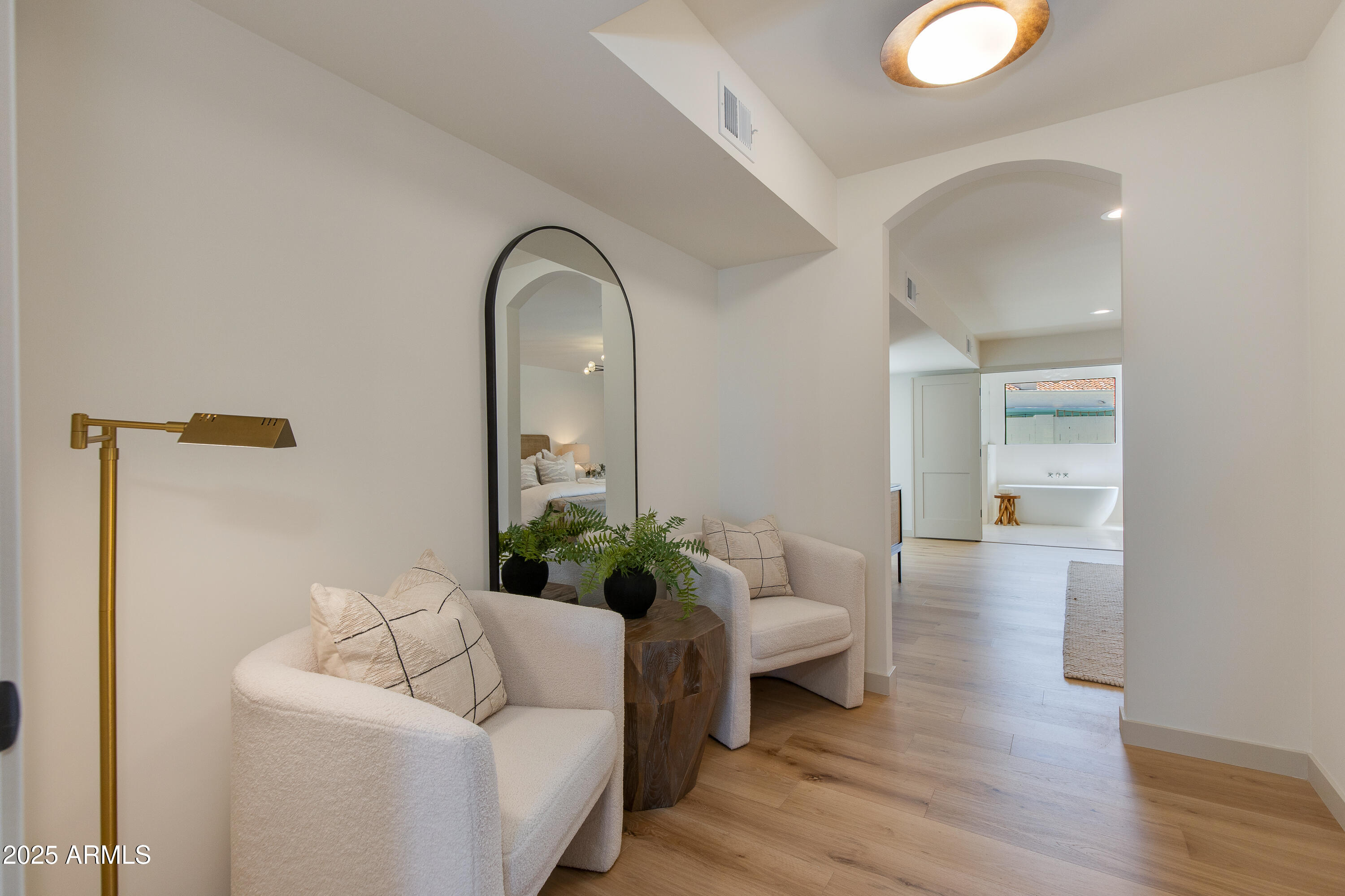 7328 East Laredo Lane Scottsdale, AZ 85250 - Photo 12 of 27 a living room with furniture and a potted plant