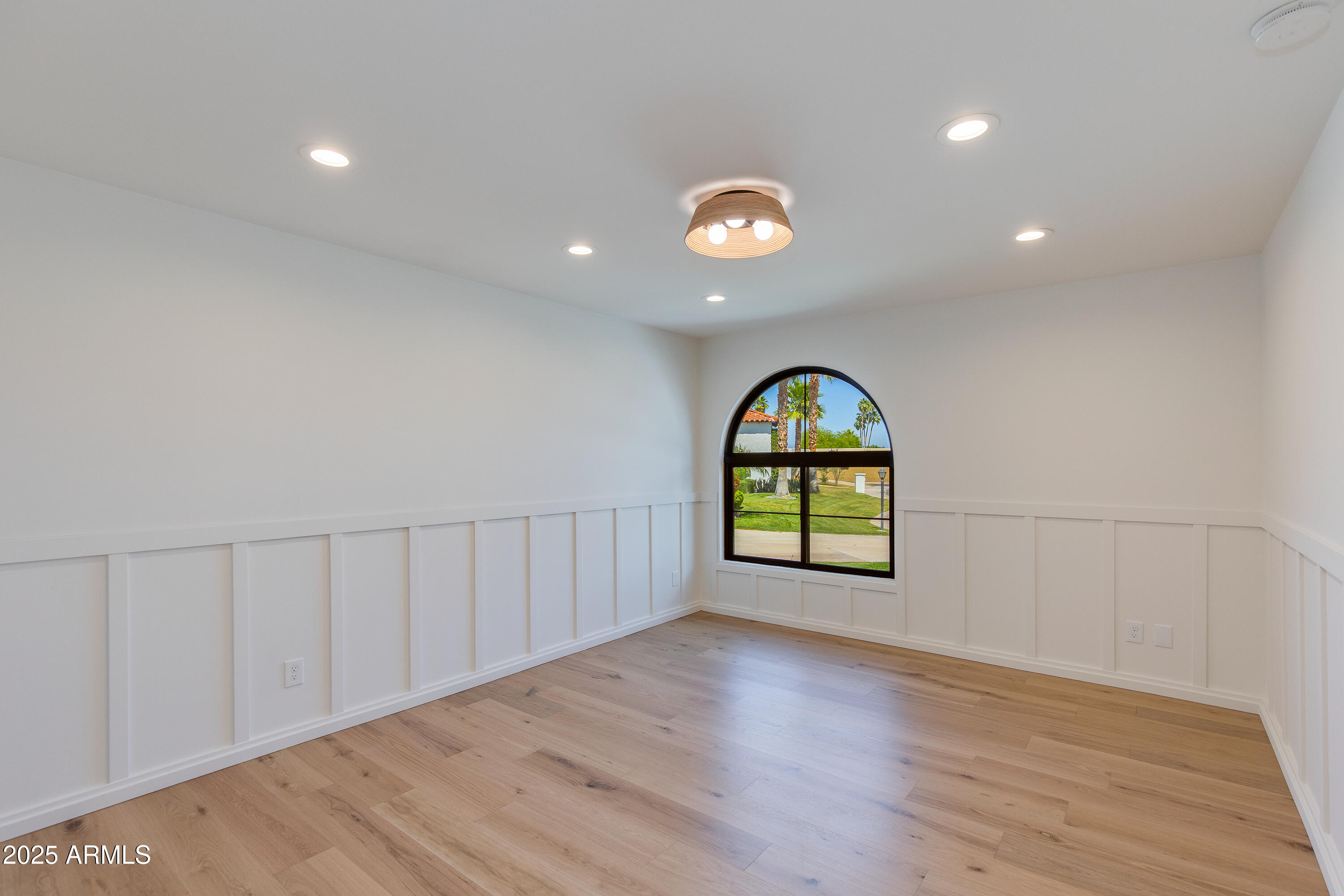 7328 East Laredo Lane Scottsdale, AZ 85250 - Photo 17 of 27 a view of a room with wooden floor and window
