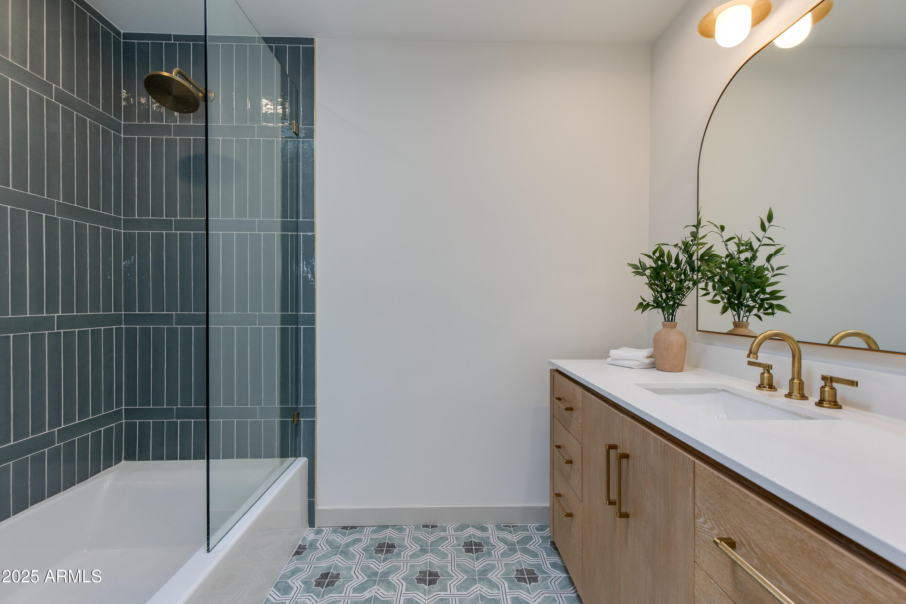 7328 East Laredo Lane Scottsdale, AZ 85250 - Photo 18 of 27 a bathroom with a shower sink vanity and tub