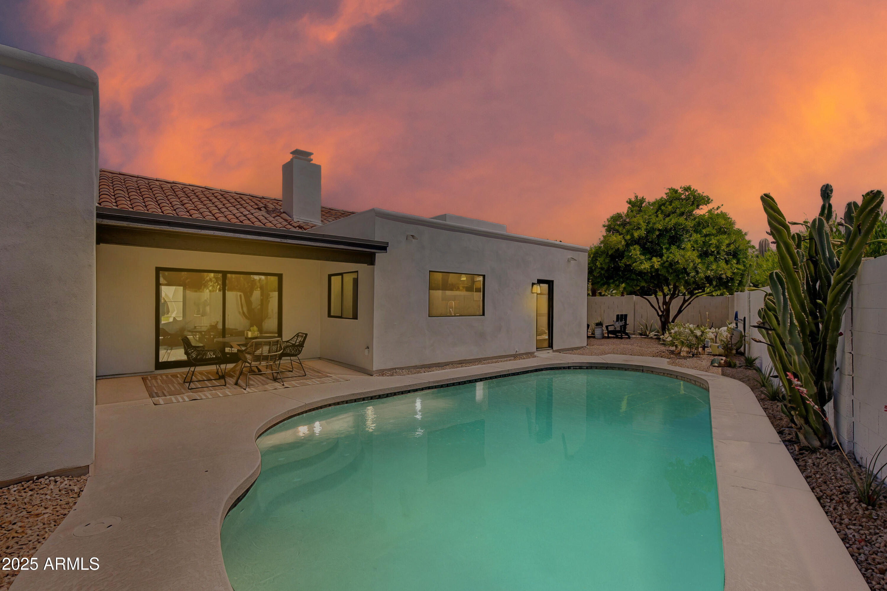 7328 East Laredo Lane Scottsdale, AZ 85250 - Photo 19 of 27 a view of a house with swimming pool and sitting area