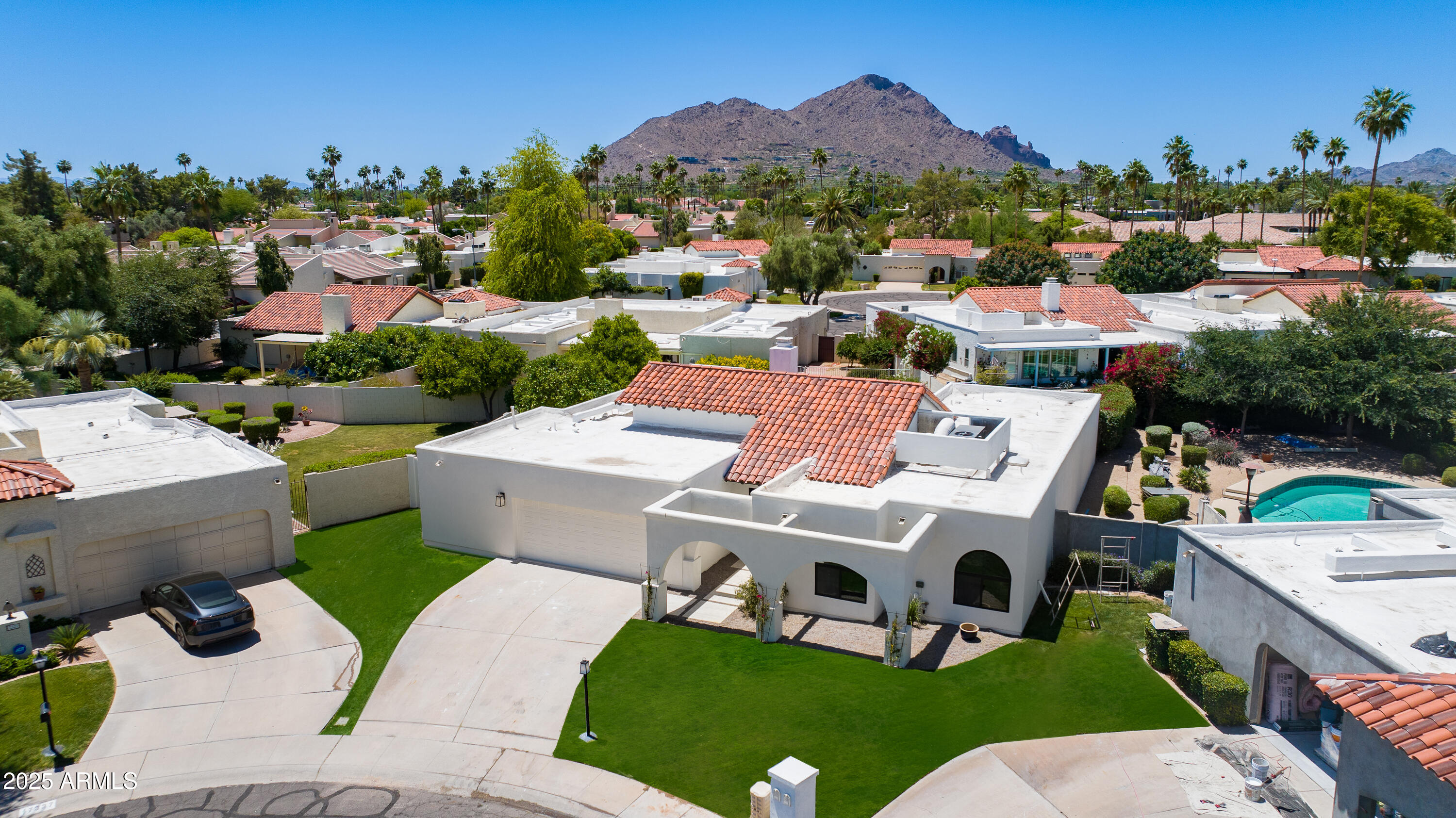 7328 East Laredo Lane Scottsdale, AZ 85250 - Photo 23 of 27 a view of a house with a garden and mountain view in back