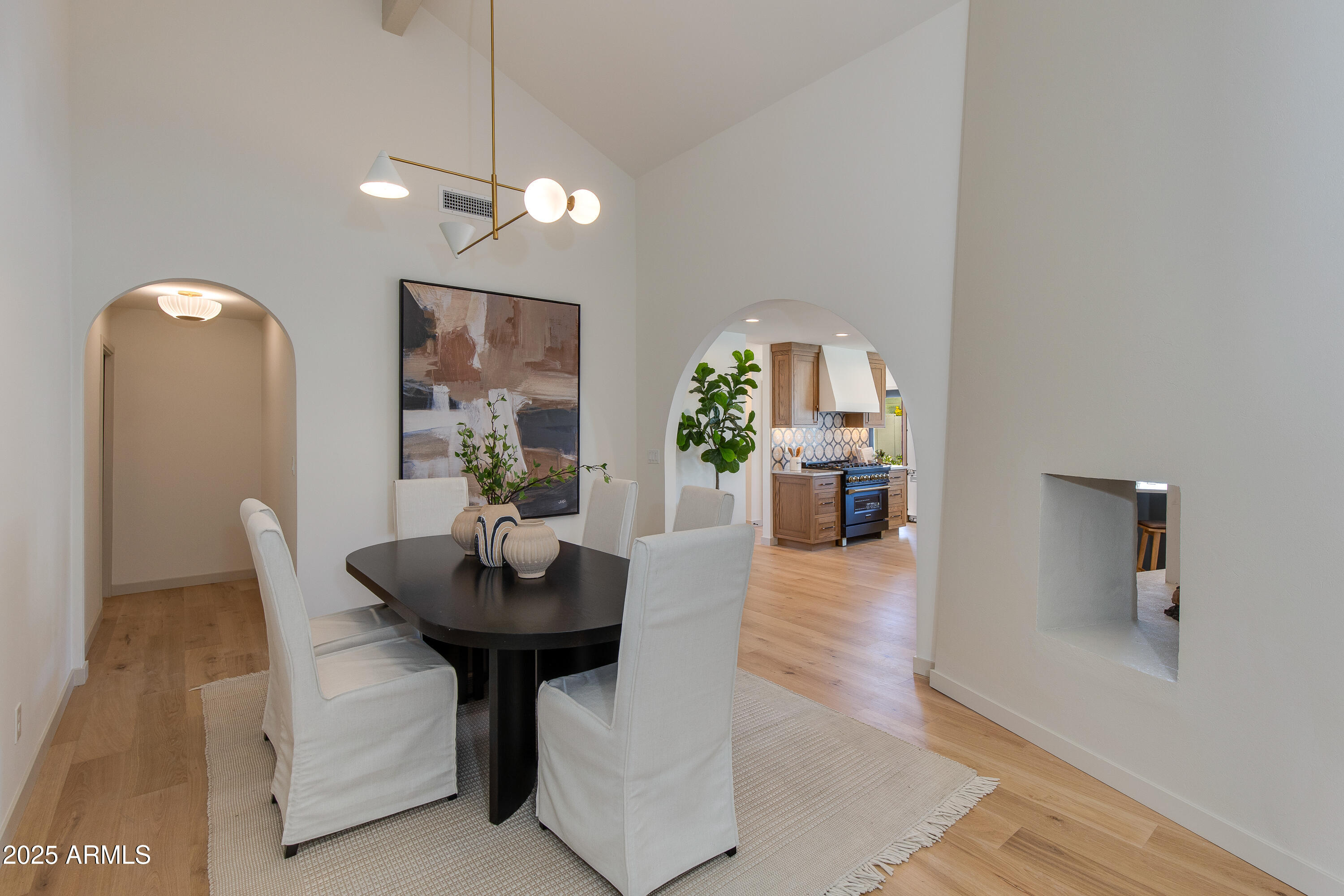 7328 East Laredo Lane Scottsdale, AZ 85250 - Photo 6 of 27 a view of a dining room with furniture and wooden floor