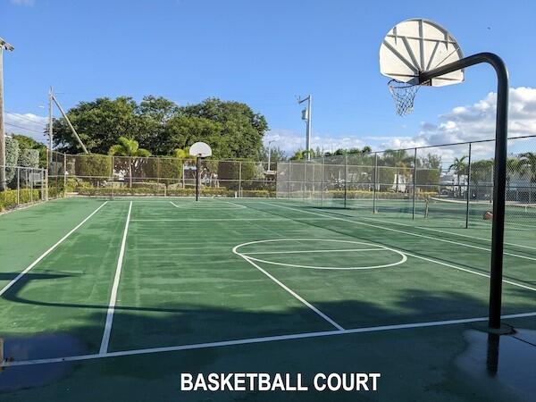 325 Calusa Street, Unit 475 Key Largo, FL 33037 - Photo 18 of 28 a view of a tennis ground with huge green field and trees in the background