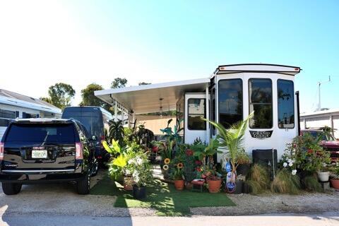 325 Calusa Street, Unit 475 Key Largo, FL 33037 - Photo 2 of 28 a front view of a house with garden