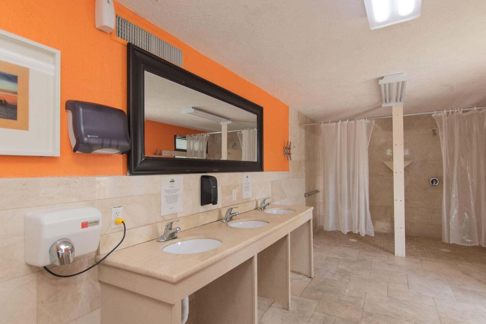 325 Calusa Street, Unit 475 Key Largo, FL 33037 - Photo 22 of 28 a bathroom with a sink and a mirror