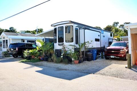 325 Calusa Street, Unit 475 Key Largo, FL 33037 - Photo 10 of 28 a view of a house with a yard