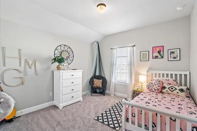 a bedroom with furniture and a window