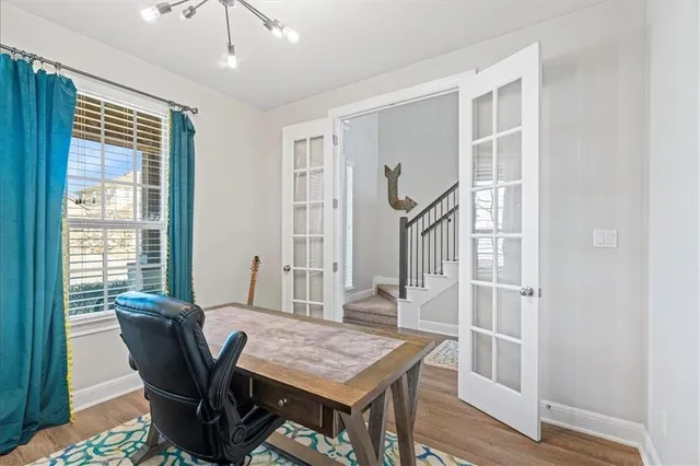a view of a dining room with furniture window and wooden floor