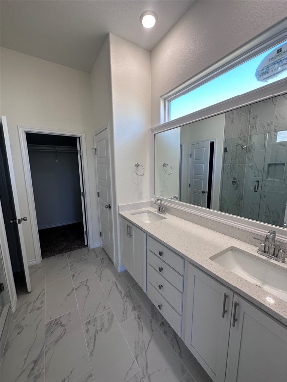 6506 Sam Houston Street Corpus Christi, TX 78414 - Photo 13 of 26 a spacious bathroom with a double vanity sink and a mirror