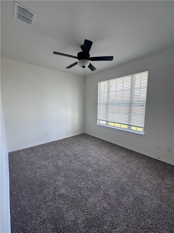 6506 Sam Houston Street Corpus Christi, TX 78414 - Photo 21 of 26 an empty room with windows and fan