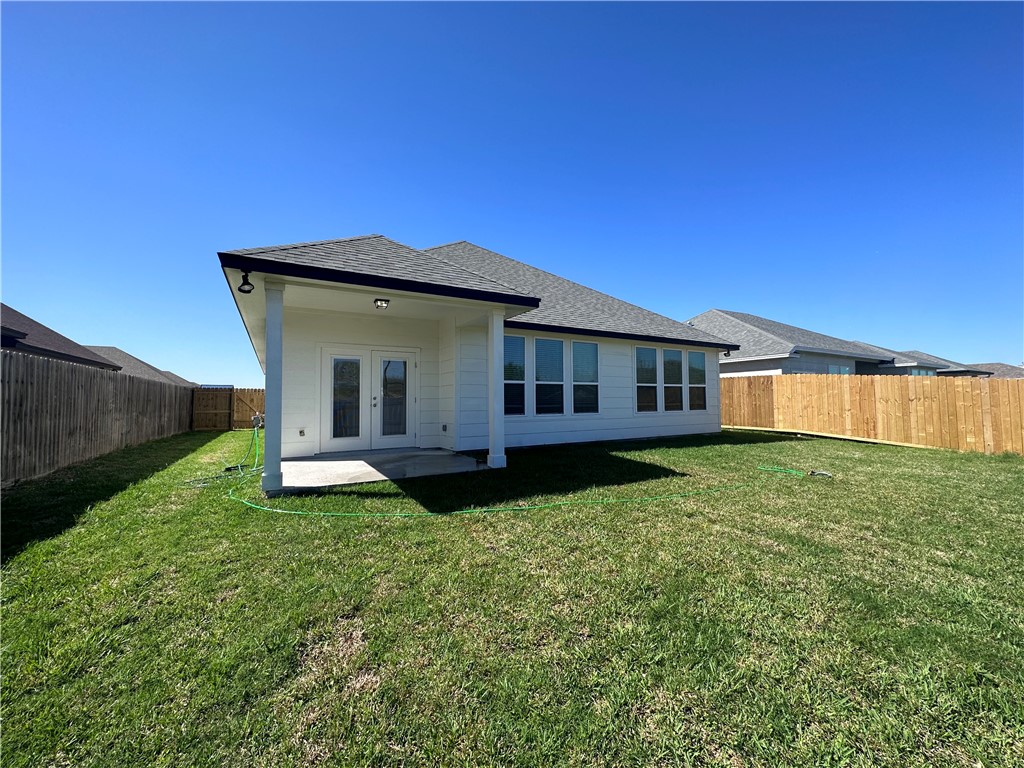 6506 Sam Houston Street Corpus Christi, TX 78414 - Photo 26 of 26 a view of a house with backyard sitting area and garden