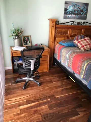a bedroom with a bed and a table in it