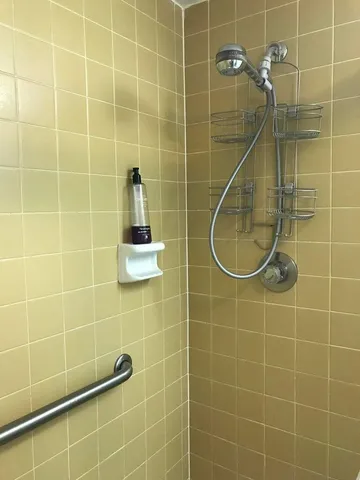 a bathroom with a blue shower