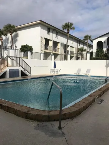 a view of houses with a swimming pool