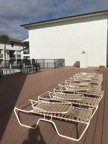 a view of terrace with seating area