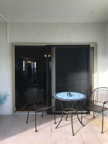a view of a chairs and table in a room