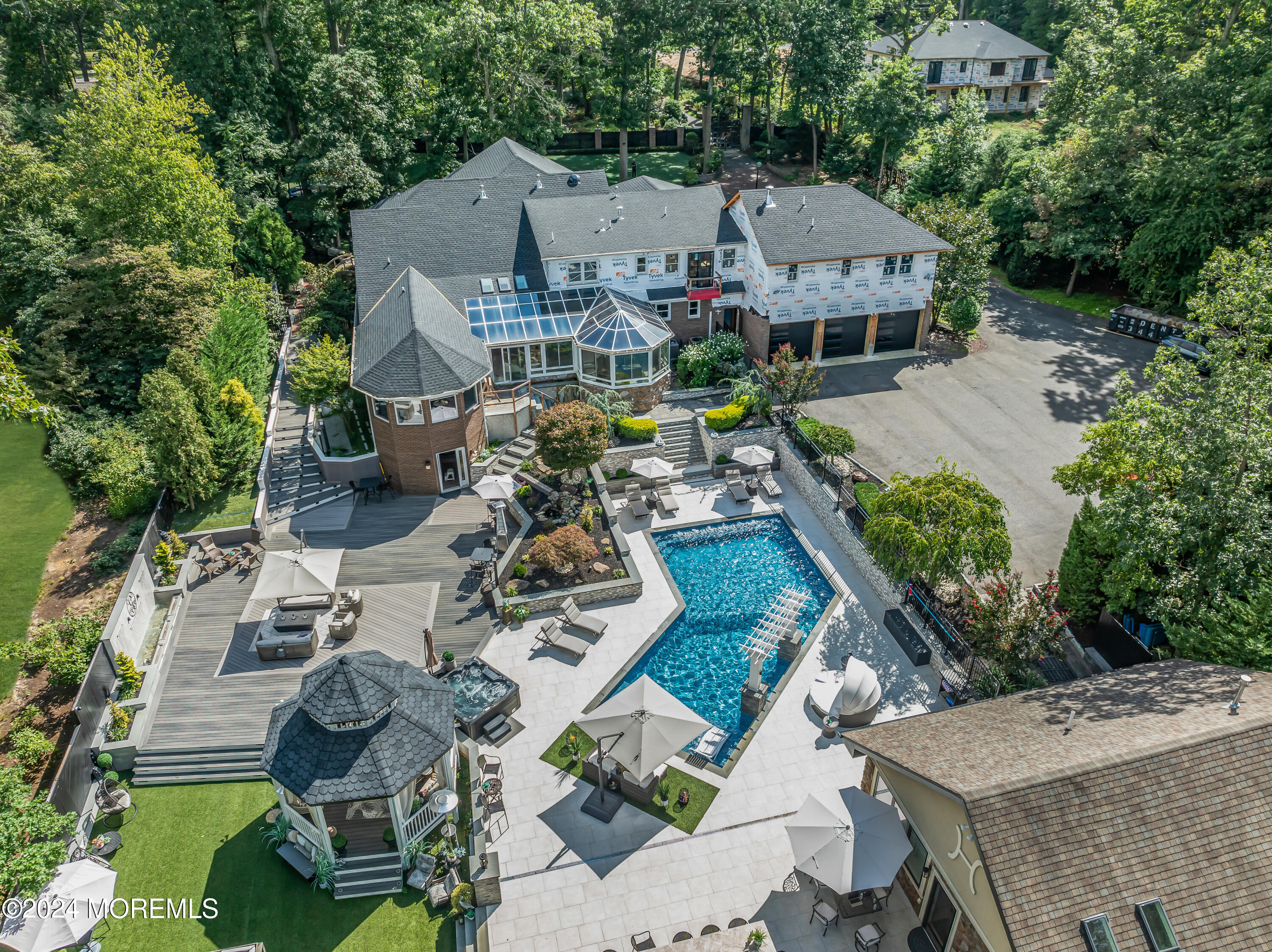 211 State Route 33 Freehold, NJ 07728 - Photo 2 of 64 an aerial view of a house with swimming pool and garden