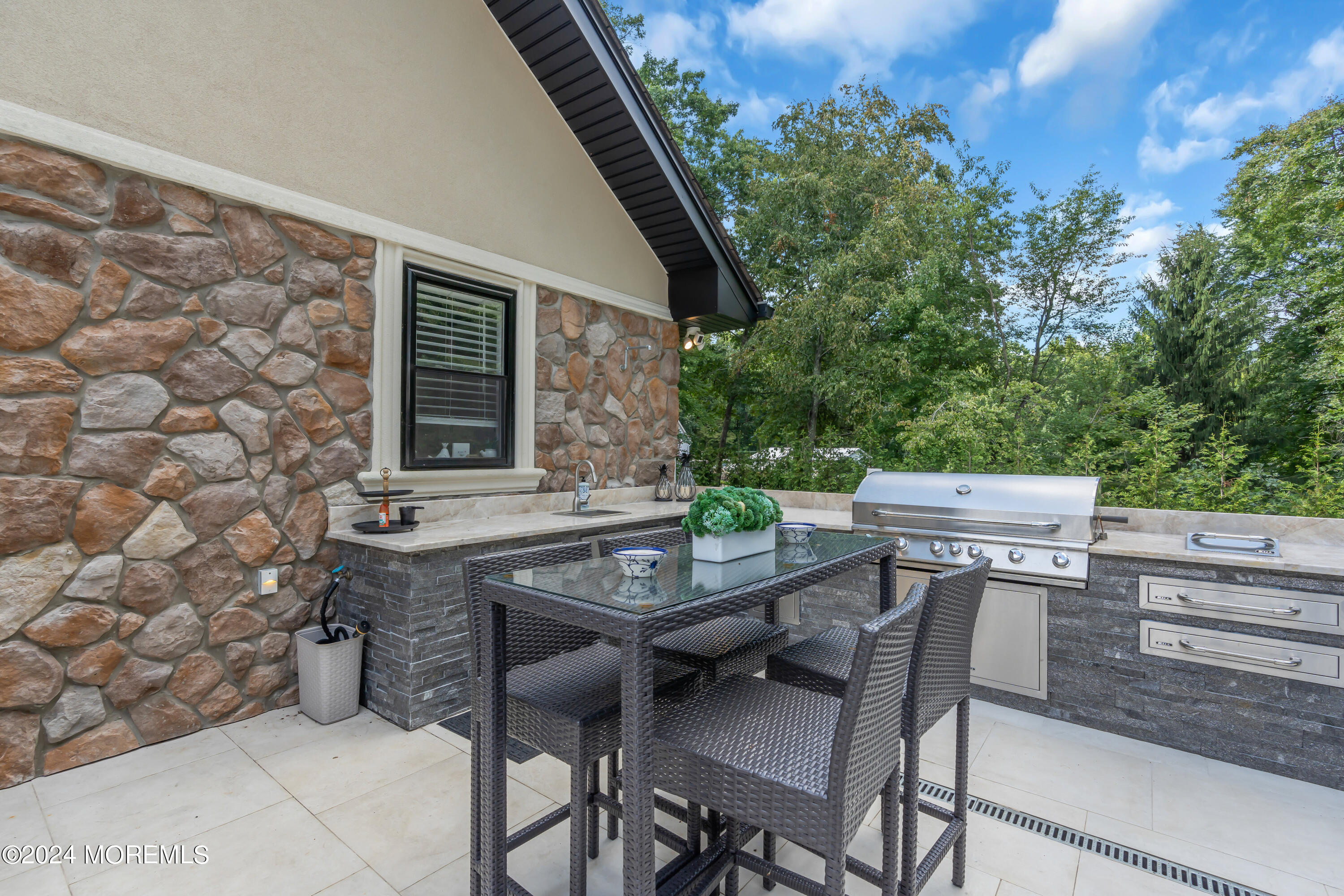 211 State Route 33 Freehold, NJ 07728 - Photo 43 of 64 a backyard of a house with table and chairs