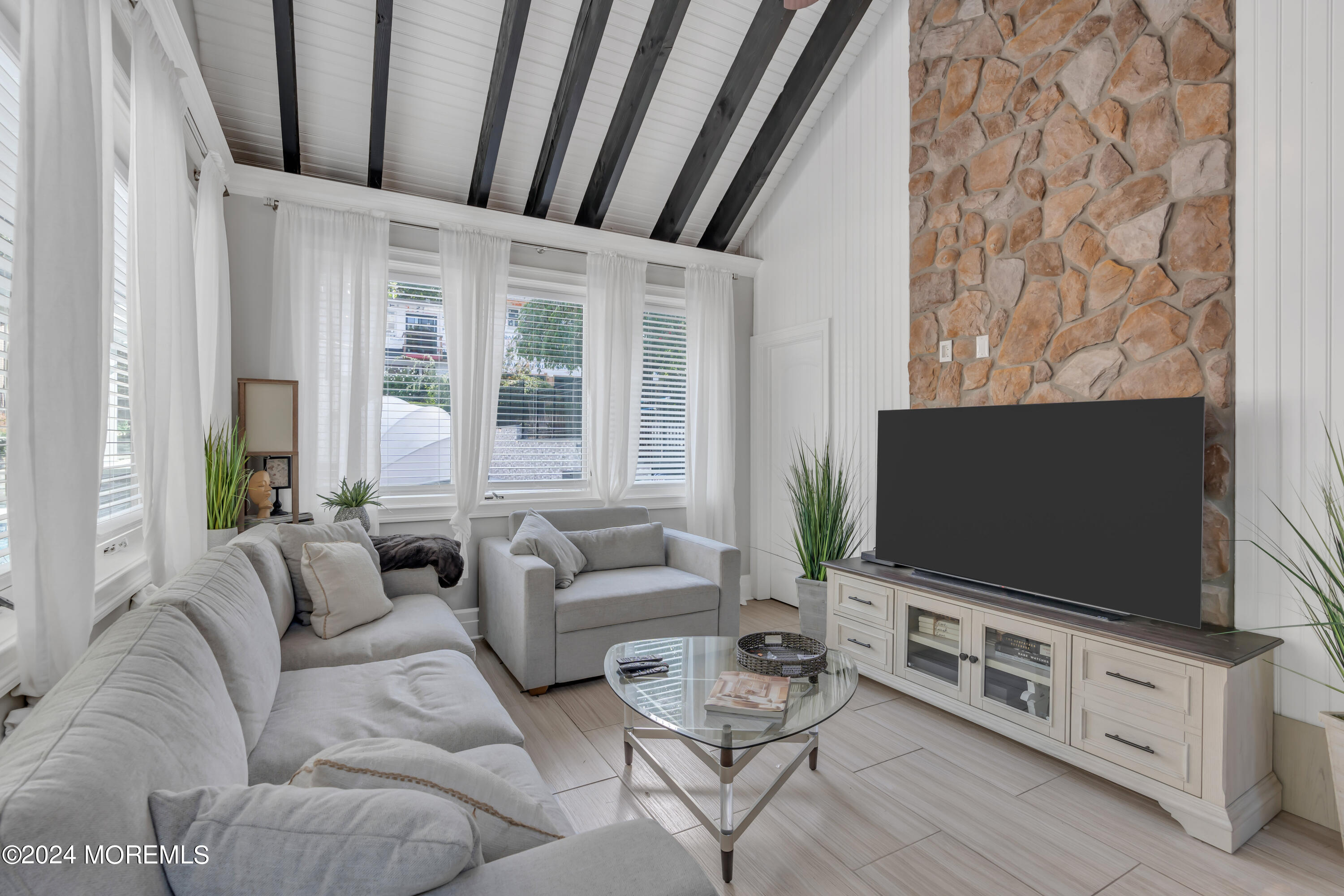 211 State Route 33 Freehold, NJ 07728 - Photo 52 of 64 a living room with furniture and a flat screen tv