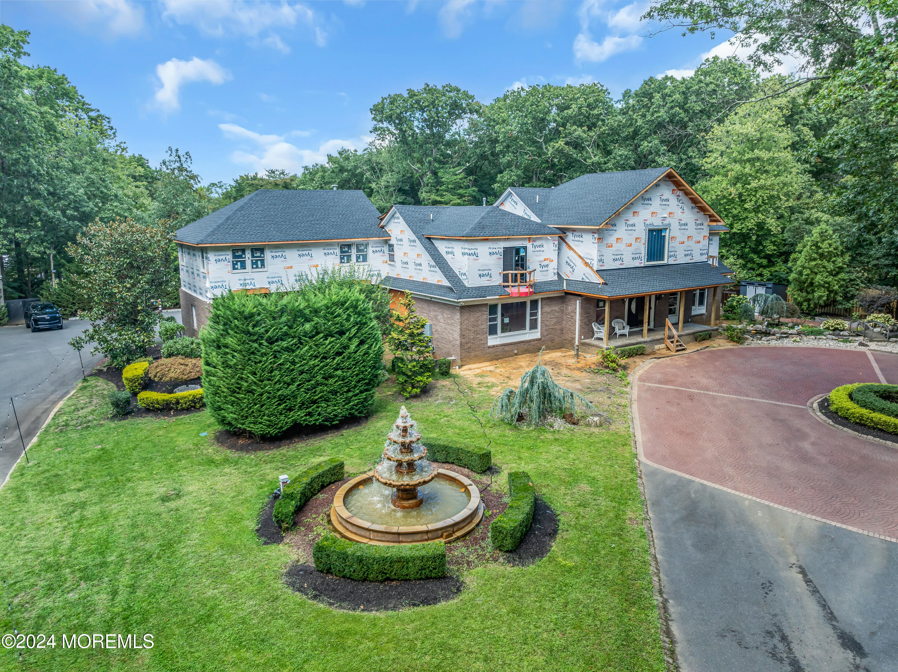 211 State Route 33 Freehold, NJ 07728 - Photo 63 of 64 a view of a house with garden and a patio