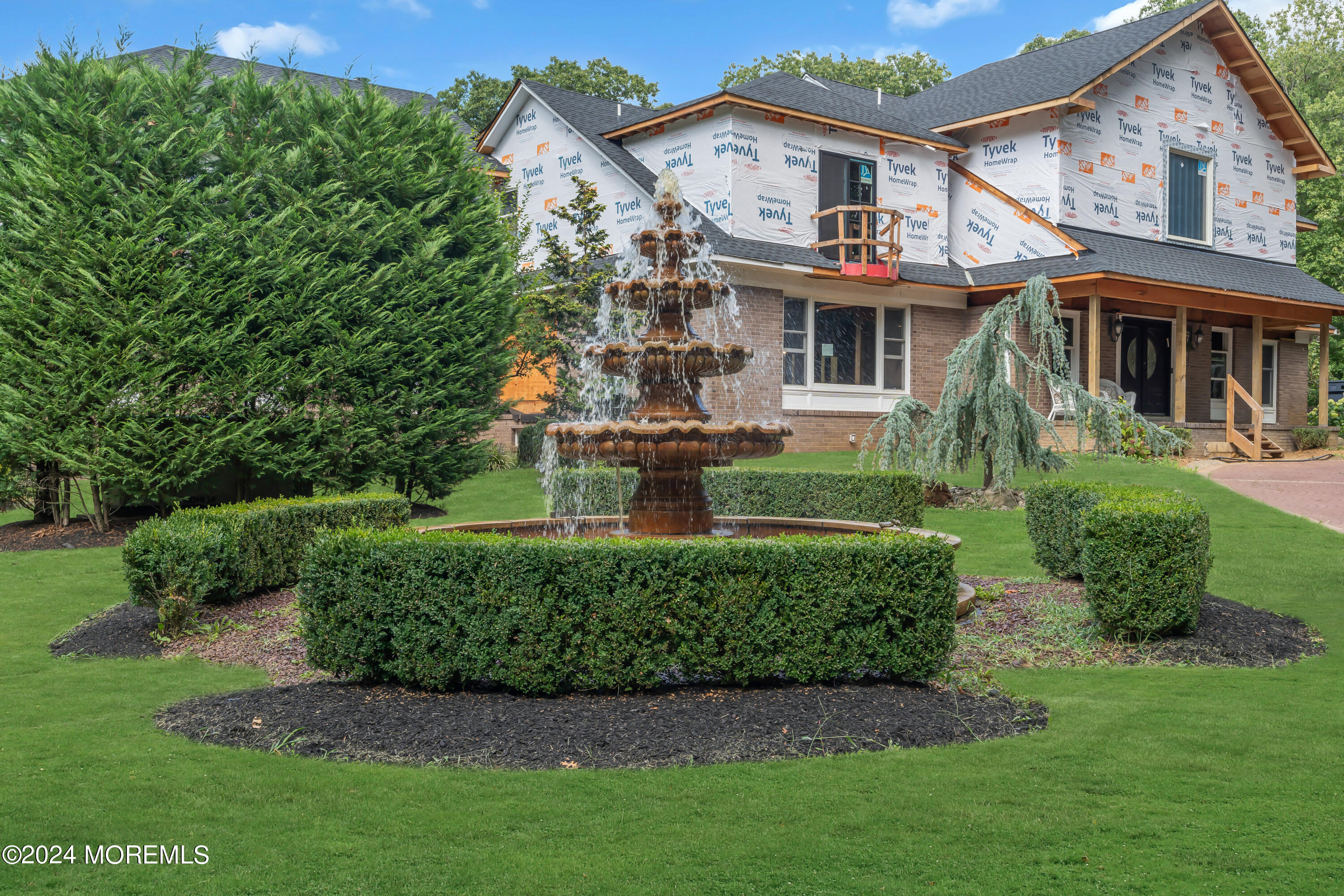 211 State Route 33 Freehold, NJ 07728 - Photo 7 of 64 a front view of a house with a yard