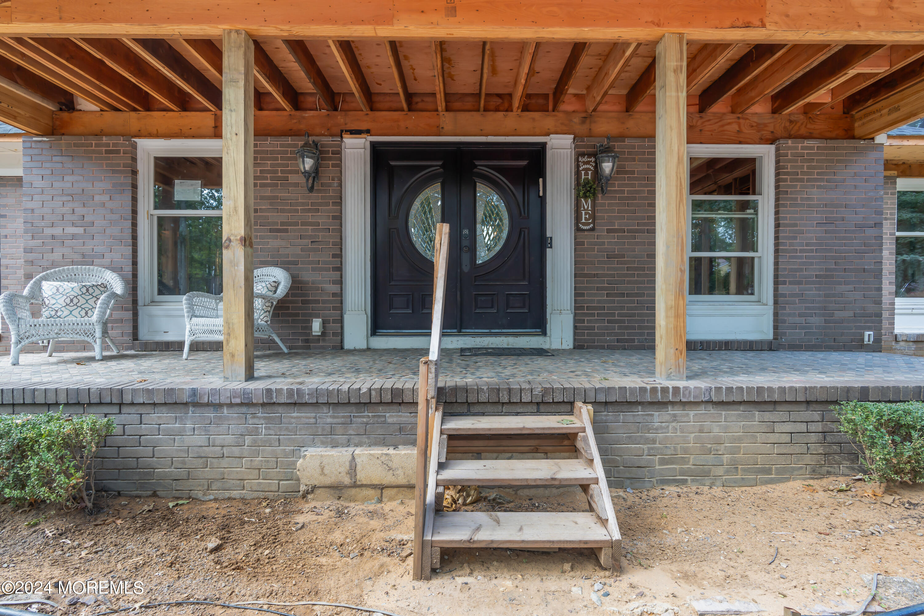 211 State Route 33 Freehold, NJ 07728 - Photo 10 of 64 a front view of a house with garden