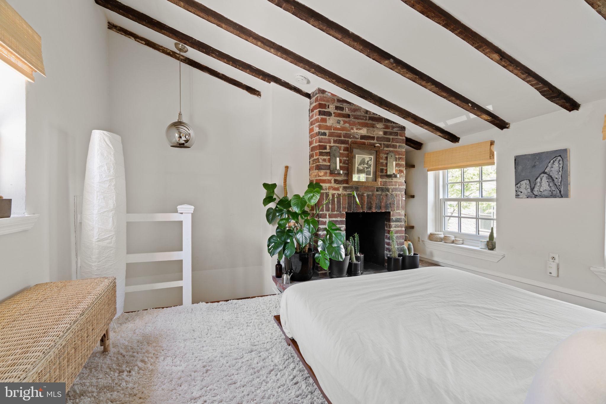 142 Carpenter Street Philadelphia, PA 19147 - Photo 41 of 49 a bed room with a bed and a television