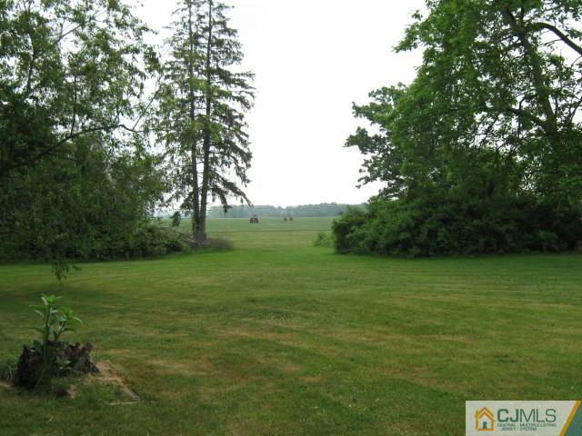 1267 Old York Road Robbinsville, NJ 08691 - Photo 4 of 6 a view of a grassy field with trees
